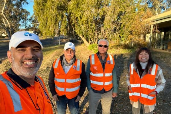 Geoporte staff on a site visit, wearing high-visibility safety vests